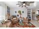 Relaxing living room with two armchairs and a colorful rug at 17470 Se 115Th Terrace Rd, Summerfield, FL 34491