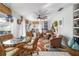 Bright and airy living room with seating area and dining space at 17470 Se 115Th Terrace Rd, Summerfield, FL 34491