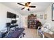 Home office with built-in bookcases and ceiling fan at 17470 Se 115Th Terrace Rd, Summerfield, FL 34491