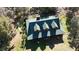 Bird's-eye view of charming log home with green roof and large yard at 1838 Sw 97Th Pl, Ocala, FL 34476