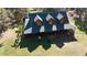 Aerial view of a log home on a large lot with mature trees at 1838 Sw 97Th Pl, Ocala, FL 34476