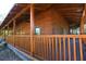 Rustic log home exterior with a large covered porch at 1838 Sw 97Th Pl, Ocala, FL 34476