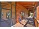 Relaxing screened-in porch with wood flooring and ceiling fan at 1838 Sw 97Th Pl, Ocala, FL 34476