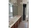 Bathroom featuring double sinks, tile floors, and a large mirror at 1908 Sw 28Th St, Ocala, FL 34471