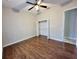 Bedroom with a ceiling fan, closet with double doors, and wood-look floors at 1908 Sw 28Th St, Ocala, FL 34471