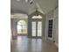 Welcoming foyer with tile flooring, leading to the living spaces with natural light and a view to the dining area at 1908 Sw 28Th St, Ocala, FL 34471