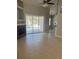 Bright living room featuring tile floors, fireplace, ceiling fan and sliding glass doors leading to the pool area at 1908 Sw 28Th St, Ocala, FL 34471