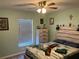 Bedroom with light walls, ceiling fan, and eagle bedding at 200 Nw 53 Ct, Ocala, FL 34482