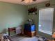 Bright bedroom with window blinds and wood-look floors at 200 Nw 53 Ct, Ocala, FL 34482