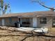 Rear view of house showing patio and landscaping at 200 Nw 53 Ct, Ocala, FL 34482