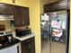 Stainless steel refrigerator and microwave in kitchen at 200 Nw 53 Ct, Ocala, FL 34482