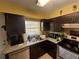 Kitchen with sink, cabinets, and appliances at 200 Nw 53 Ct, Ocala, FL 34482