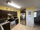 Kitchen with stainless steel appliances and wood cabinets at 200 Nw 53 Ct, Ocala, FL 34482