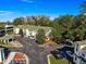 Aerial image of townhouses, parking, and surrounding trees at 231 Ne 28Th Ave # 301, Ocala, FL 34470