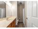 Bathroom with shower/tub combo, wood cabinets and vanity at 231 Ne 28Th Ave # 301, Ocala, FL 34470