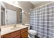 Simple bathroom with shower/tub combo, and wood cabinets at 231 Ne 28Th Ave # 301, Ocala, FL 34470