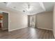 Bright bedroom with wood-look floors and ceiling fan at 231 Ne 28Th Ave # 301, Ocala, FL 34470