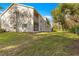 Two-story building with light beige siding and green trim at 231 Ne 28Th Ave # 301, Ocala, FL 34470