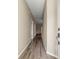 Long hallway with wood-look floors at 231 Ne 28Th Ave # 301, Ocala, FL 34470