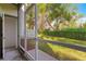 Screened porch overlooking a grassy backyard at 231 Ne 28Th Ave # 301, Ocala, FL 34470