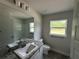 Bathroom with natural light, granite countertop, and tub and shower combo at 35 Locust Radial Cir, Ocala, FL 34472