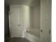 Bathroom featuring tub and shower combo, toilet, and doorways to the other rooms at 35 Locust Radial Cir, Ocala, FL 34472