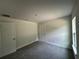 A light-filled bedroom with new carpeting, neutral colors, and large windows at 35 Locust Radial Cir, Ocala, FL 34472
