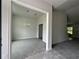 Elegant dining area with modern chandelier, neutral paint and open doorway at 35 Locust Radial Cir, Ocala, FL 34472