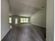 Spacious living room featuring vaulted ceilings, recessed lighting, and ample natural light at 35 Locust Radial Cir, Ocala, FL 34472