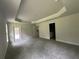 Large main bedroom with walkout door, and doorways to the bathroom and other rooms at 35 Locust Radial Cir, Ocala, FL 34472