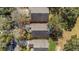 Aerial view of the home's roofline and backyard from above at 3708 Doune Way, Clermont, FL 34711