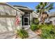 Florida home exterior with landscaped yard, screened porch, and attached garage at 3708 Doune Way, Clermont, FL 34711