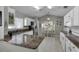 Spacious kitchen featuring granite countertops, white cabinets, and breakfast nook at 3708 Doune Way, Clermont, FL 34711