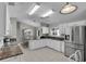 Spacious kitchen featuring granite countertops and white cabinetry at 3708 Doune Way, Clermont, FL 34711