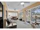 Relaxing sunroom with wicker furniture and large windows at 3708 Doune Way, Clermont, FL 34711