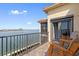 Spacious balcony with water views and seating at 438 Bouchelle Dr # 401, New Smyrna Beach, FL 32169