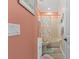 Charming bathroom with coral-themed decor and tub shower combination at 438 Bouchelle Dr # 401, New Smyrna Beach, FL 32169