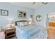 Bright bedroom with a queen bed and en-suite bathroom at 438 Bouchelle Dr # 401, New Smyrna Beach, FL 32169