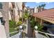 Landscaped walkway with lush tropical plants leading to parking at 438 Bouchelle Dr # 401, New Smyrna Beach, FL 32169