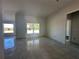 Bright living room with tile floors and large windows at 4421 Sw 90Th Pl, Ocala, FL 34476