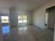 Bright living room with tile floors and large windows at 4421 Sw 90Th Pl, Ocala, FL 34476