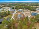 An aerial view of a house on a tree-lined street in a residential neighborhood at 5077 Sw 107Th Loop, Ocala, FL 34476