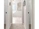 View down hallway to bathroom with tiled floor, bathtub, and shower at 5077 Sw 107Th Loop, Ocala, FL 34476