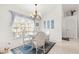 Charming dining area with white table and chairs, and decorative rug at 5077 Sw 107Th Loop, Ocala, FL 34476