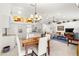 Bright dining area with a wooden table and white chairs at 5077 Sw 107Th Loop, Ocala, FL 34476