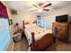 Cozy bedroom with a queen-size bed and wood floors at 5991 Nw 61St Ct, Ocala, FL 34482