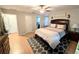 Bright bedroom with large bed and ensuite bathroom at 5991 Nw 61St Ct, Ocala, FL 34482