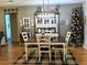 Charming dining room featuring a farmhouse-style table and hutch at 5991 Nw 61St Ct, Ocala, FL 34482