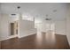 Spacious living room with wood-look floors and high ceilings at 6558 Se 9Th Pl, Ocala, FL 34472