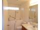 Accessible bathroom with walk-in tub, grab bars, and updated vanity at 7106 Sw 115Th Loop, Ocala, FL 34476